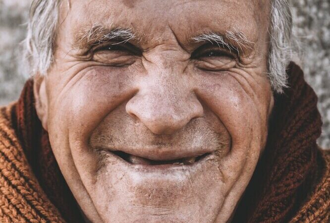 smiling old man with white hair